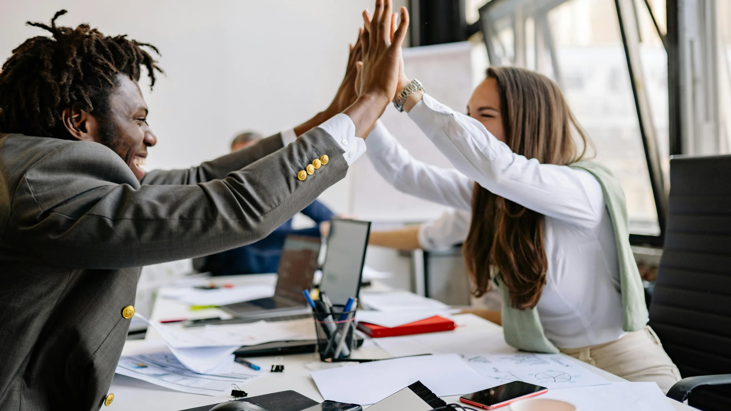 Team celebrating a successful deal